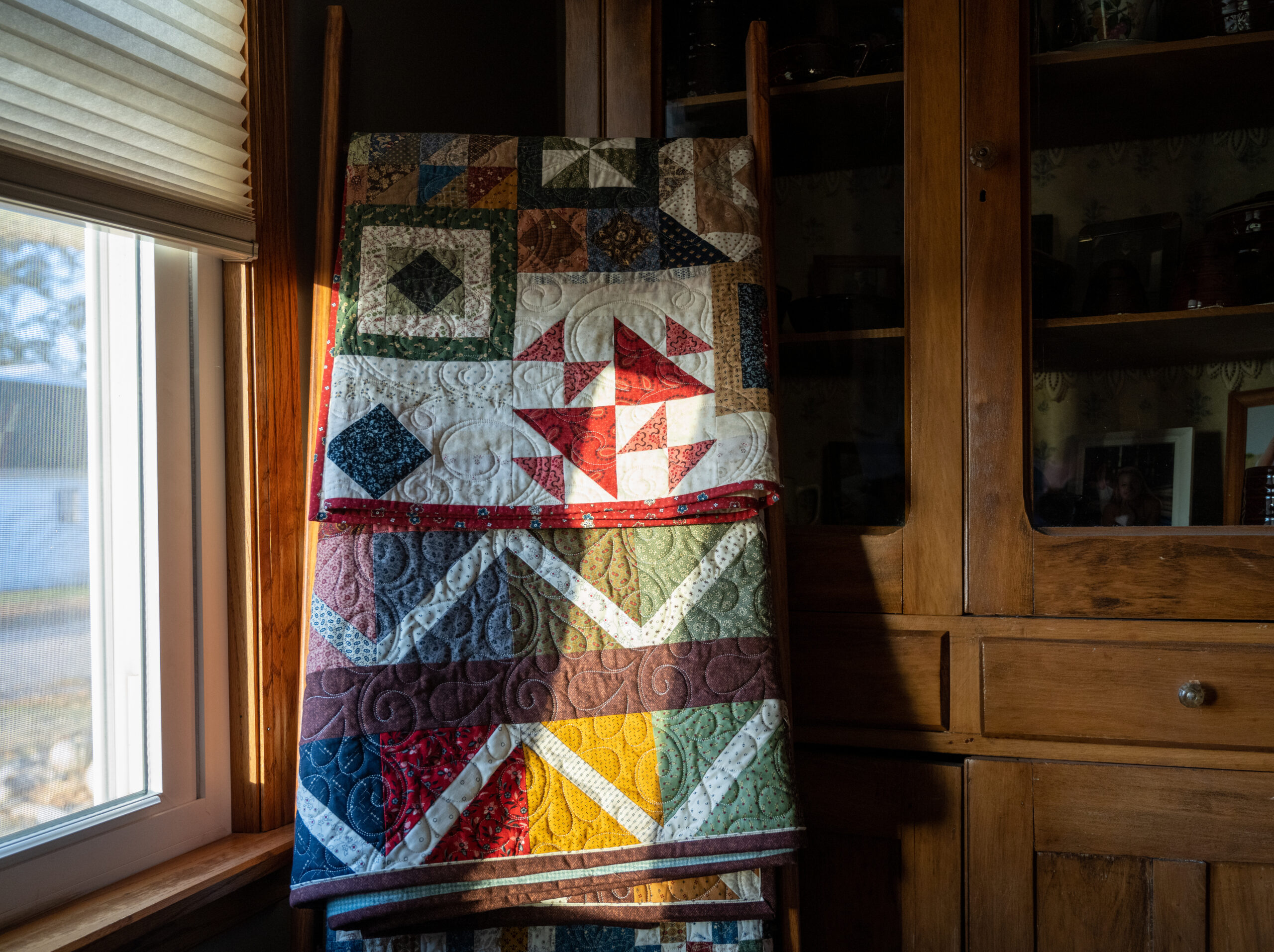 tradtional quilt on a chest of drawers